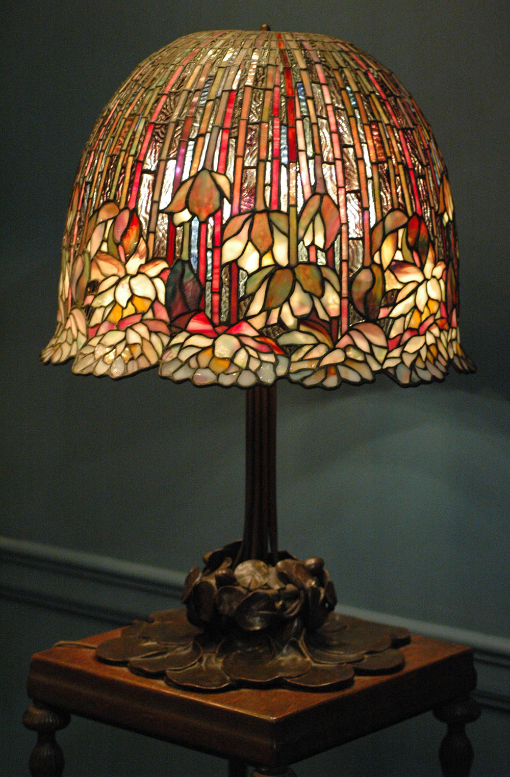 A Louis Comfort Tiffany Lamp with flower pattern design.