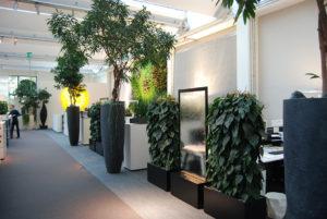 Water walls in the ArtAqua office incorporate Presence of Water biophilic design pattern