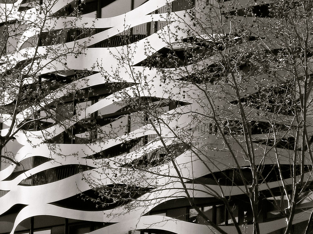 Facade renovation of Suites Avenue Aparthotel by Toyo Ito, Barcelona, Spain, is biomorphic in form, while enhancing the Dynamic & Diffuse light and shadows filtering to the interior space.