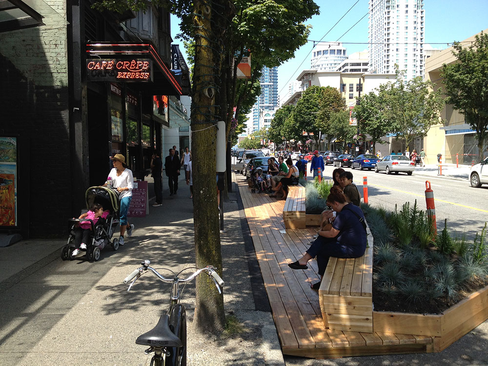 Park-ing Day Make-shift outdoor seating with temporary landscaping in the streets.  